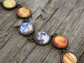 Aura Cosmic Cabochon Bracelet — Bronze Solar System Planet Strand