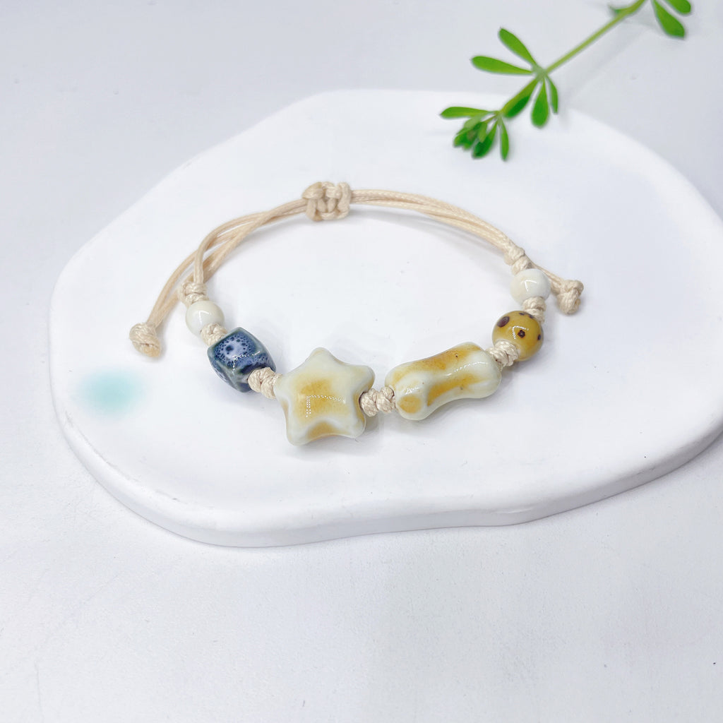 Aura Artisan Ceramic Charm Strand — Hand-Woven Friendship Bracelet