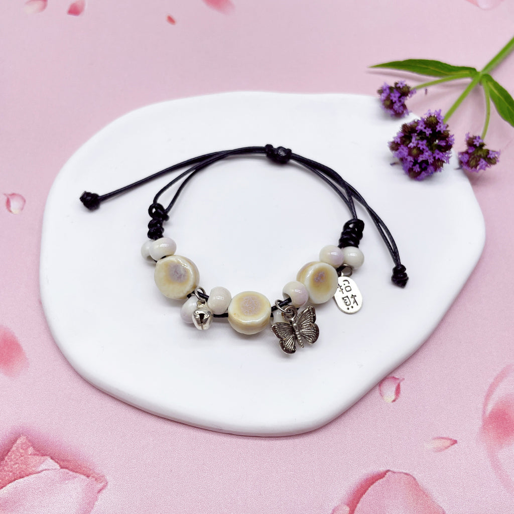 Aura Artisan Ceramic Charm Strand — Hand-Woven Friendship Bracelet
