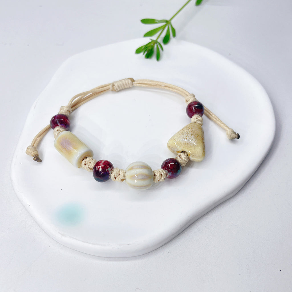 Aura Artisan Ceramic Charm Strand — Hand-Woven Friendship Bracelet
