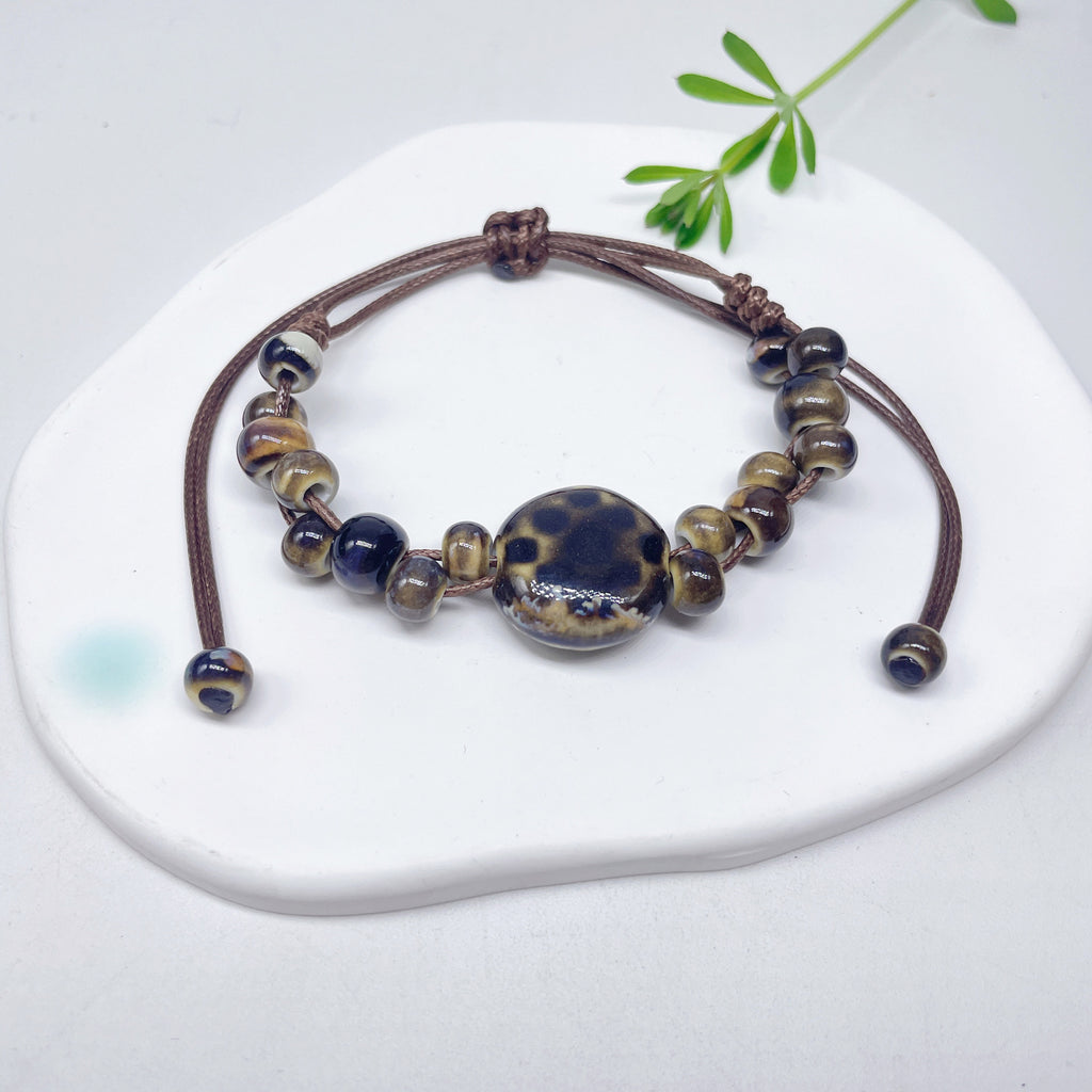 Aura Artisan Ceramic Charm Strand — Hand-Woven Friendship Bracelet