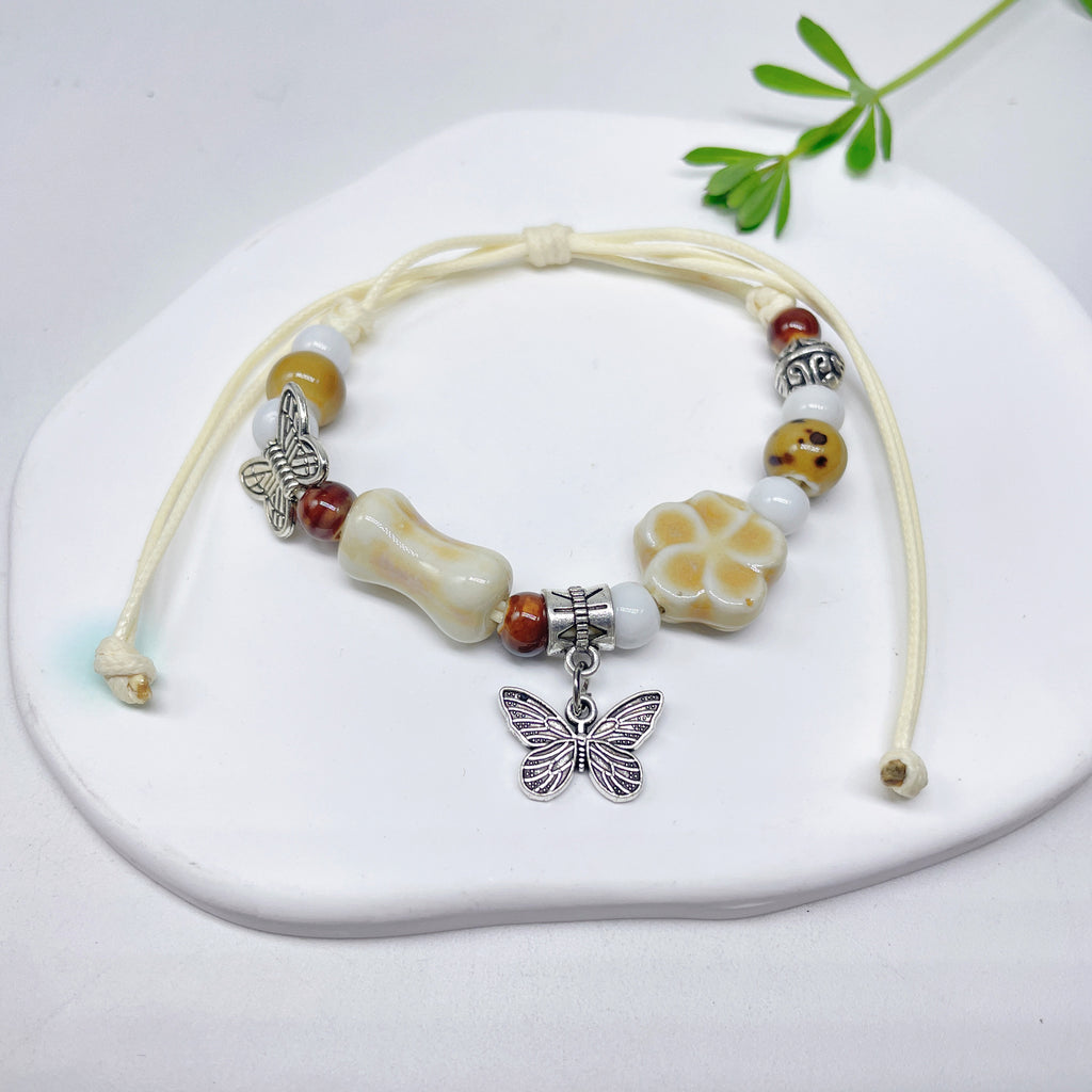 Aura Artisan Ceramic Charm Strand — Hand-Woven Friendship Bracelet