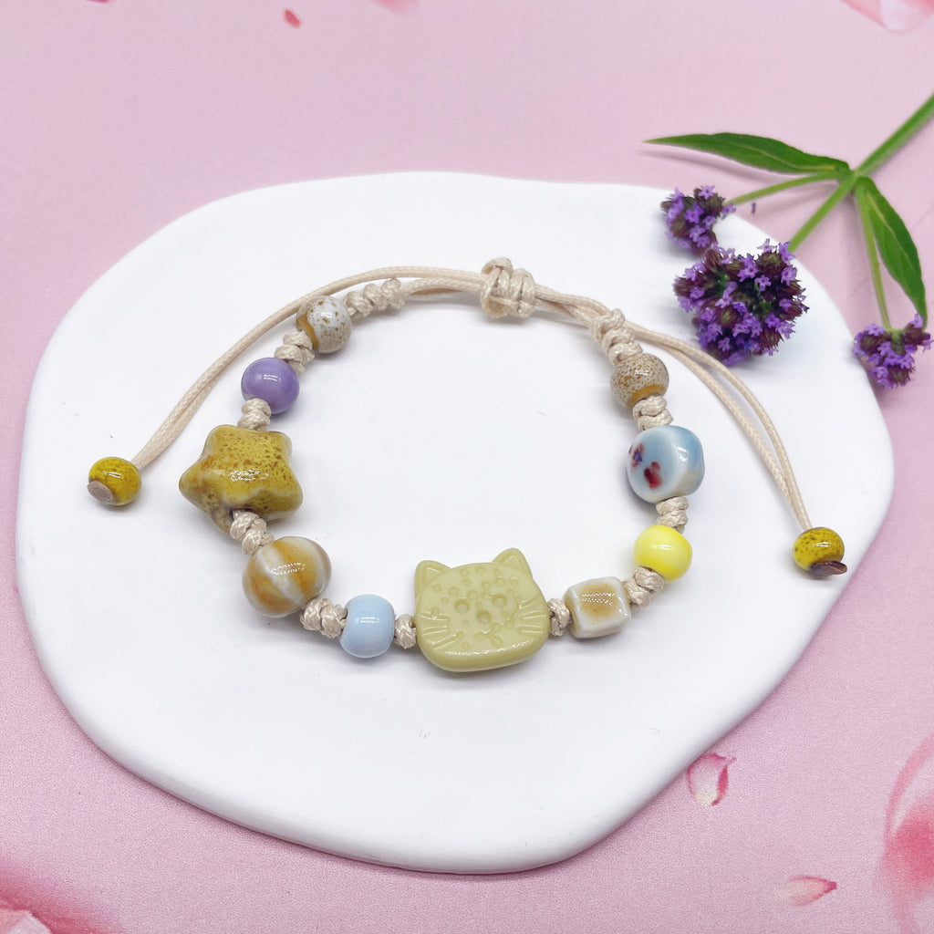 Aura Artisan Ceramic Charm Strand — Hand-Woven Friendship Bracelet