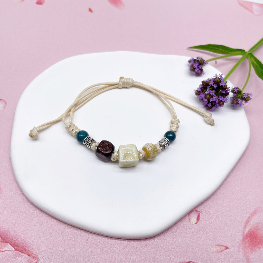 Aura Artisan Ceramic Charm Strand — Hand-Woven Friendship Bracelet