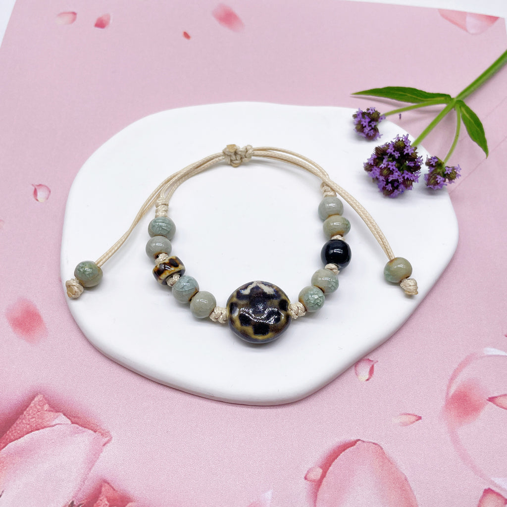 Aura Artisan Ceramic Charm Strand — Hand-Woven Friendship Bracelet