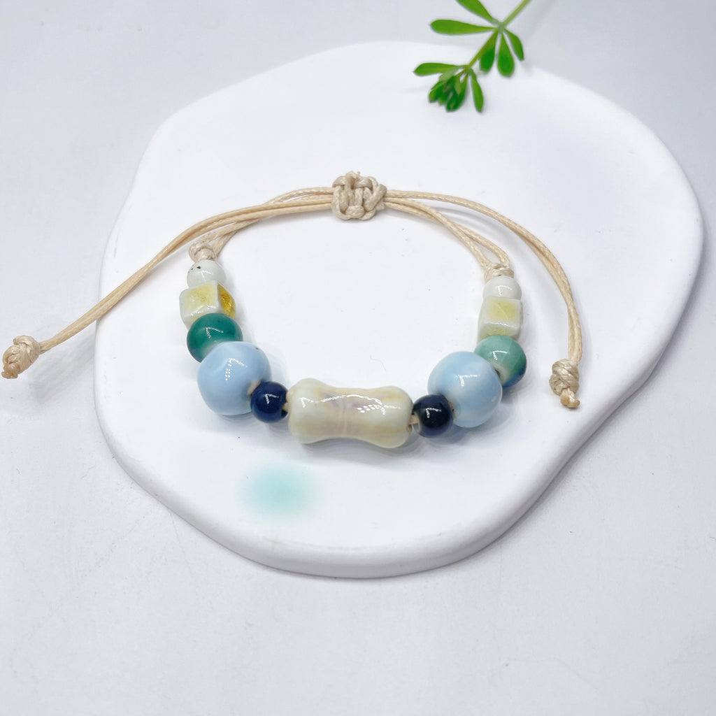 Aura Artisan Ceramic Charm Strand — Hand-Woven Friendship Bracelet