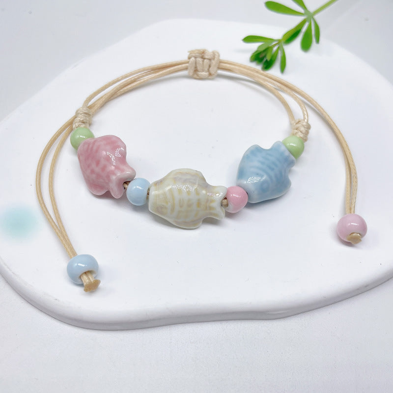 Aura Artisan Ceramic Charm Strand — Hand-Woven Friendship Bracelet