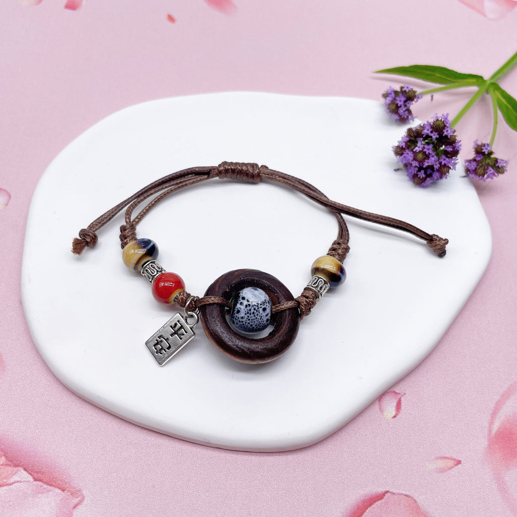 Aura Artisan Ceramic Charm Strand — Hand-Woven Friendship Bracelet