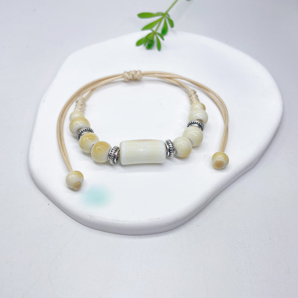 Aura Artisan Ceramic Charm Strand — Hand-Woven Friendship Bracelet