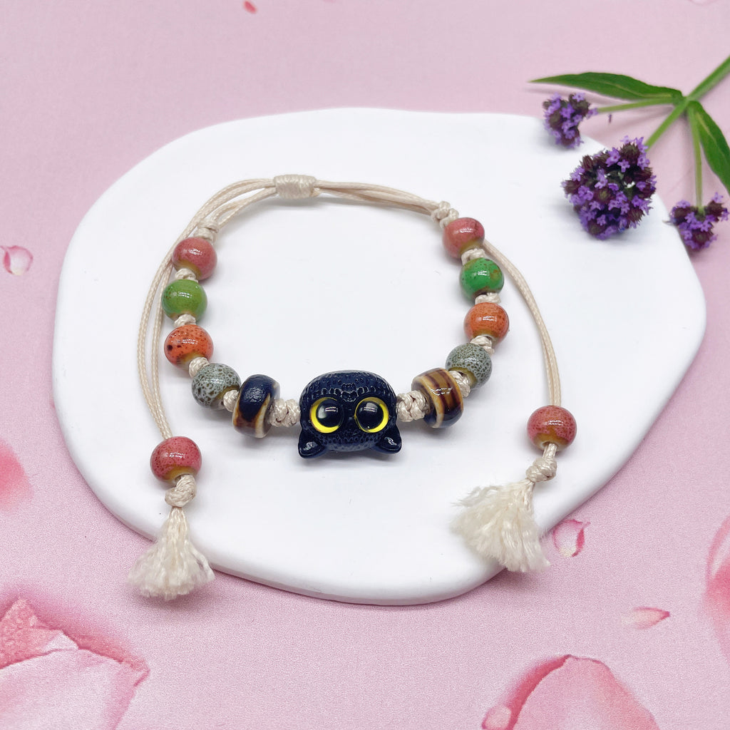 Aura Artisan Ceramic Charm Strand — Hand-Woven Friendship Bracelet