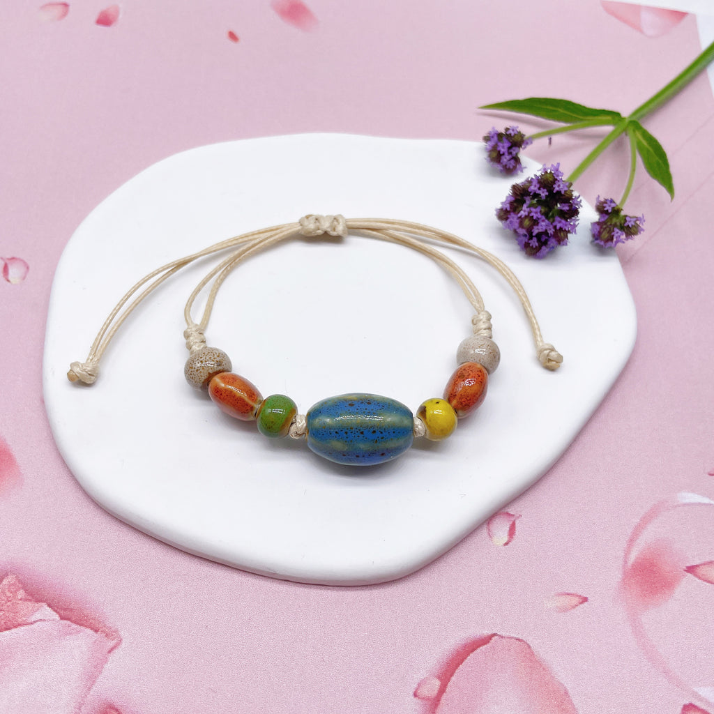 Aura Artisan Ceramic Charm Strand — Hand-Woven Friendship Bracelet