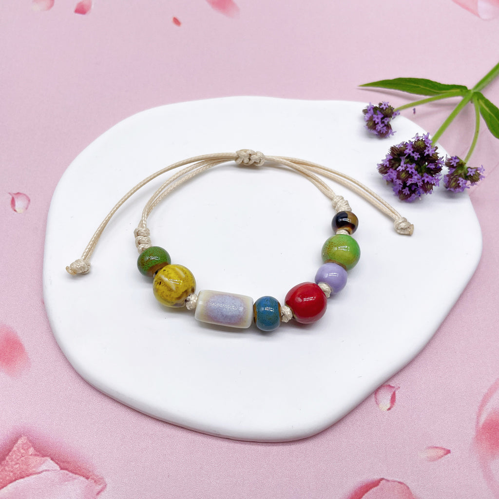 Aura Artisan Ceramic Charm Strand — Hand-Woven Friendship Bracelet