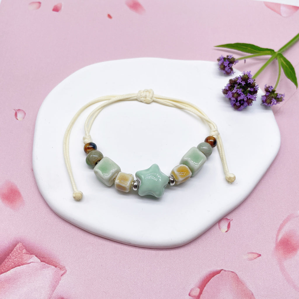 Aura Artisan Ceramic Charm Strand — Hand-Woven Friendship Bracelet