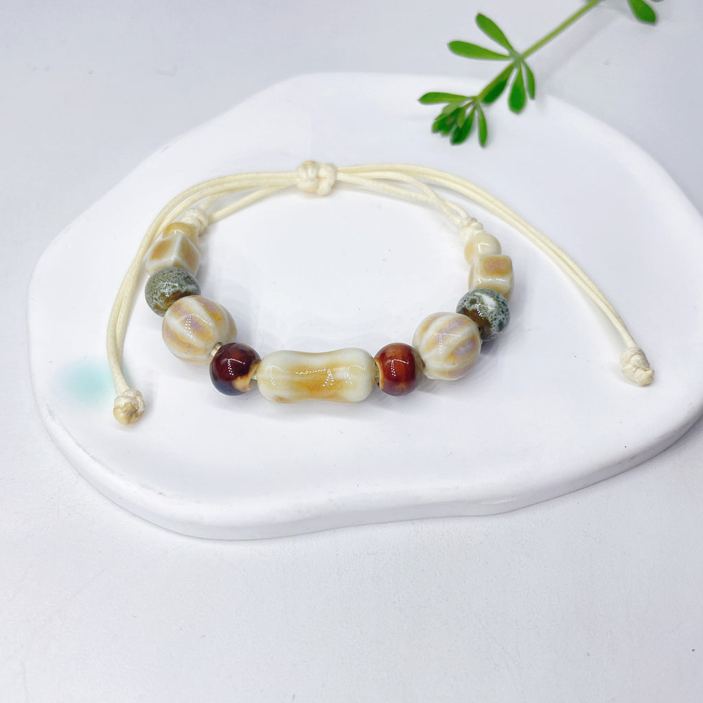 Aura Artisan Ceramic Charm Strand — Hand-Woven Friendship Bracelet