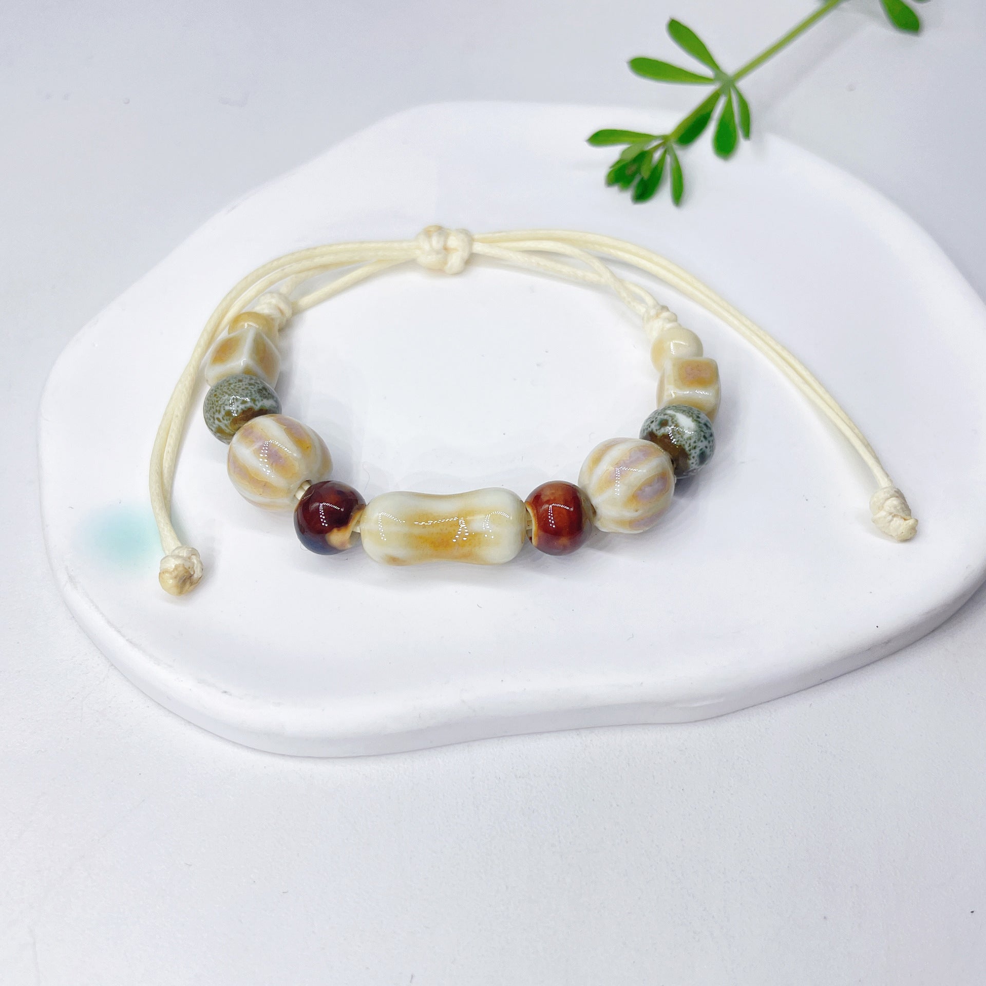 Aura Artisan Ceramic Charm Strand — Hand-Woven Friendship Bracelet
