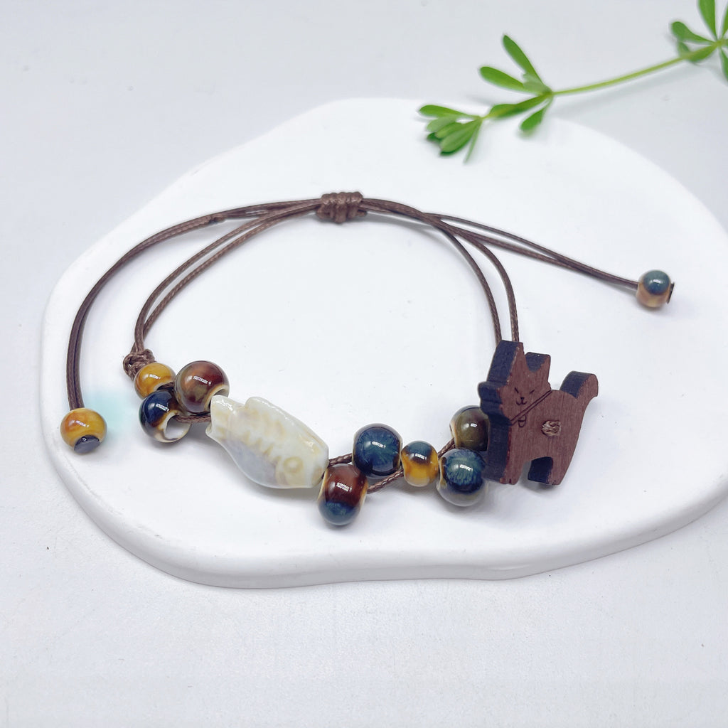 Aura Artisan Ceramic Charm Strand — Hand-Woven Friendship Bracelet